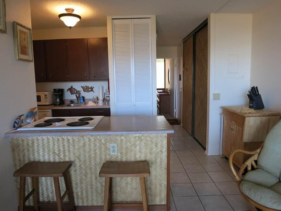 Fully equipped kitchen with microwave, coffee maker.