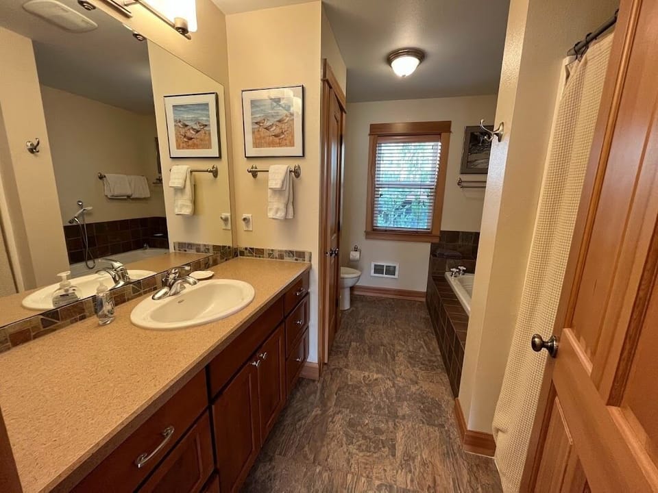 upstairs bathroom with shower and soaking tub