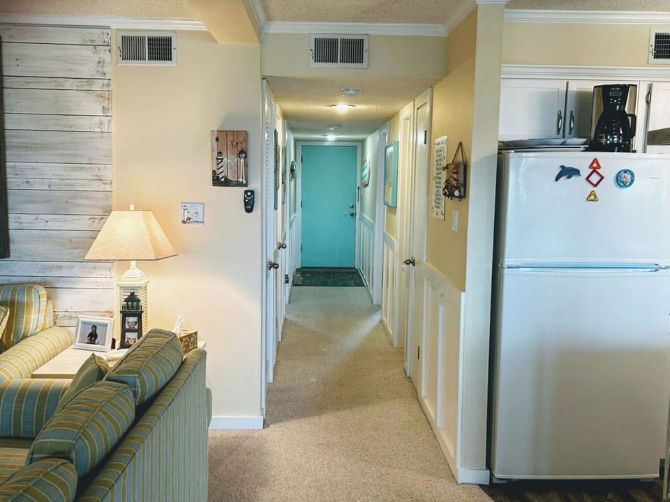 Hallway with master bedroom to left & bedroom #2 and bath #2 to right