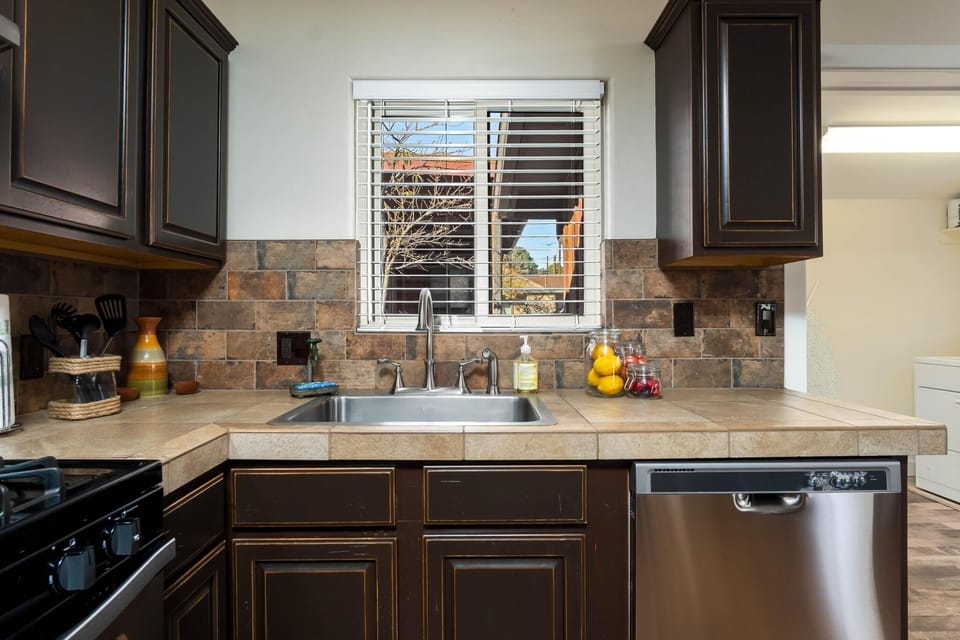 A kitchen with an outdoor view.