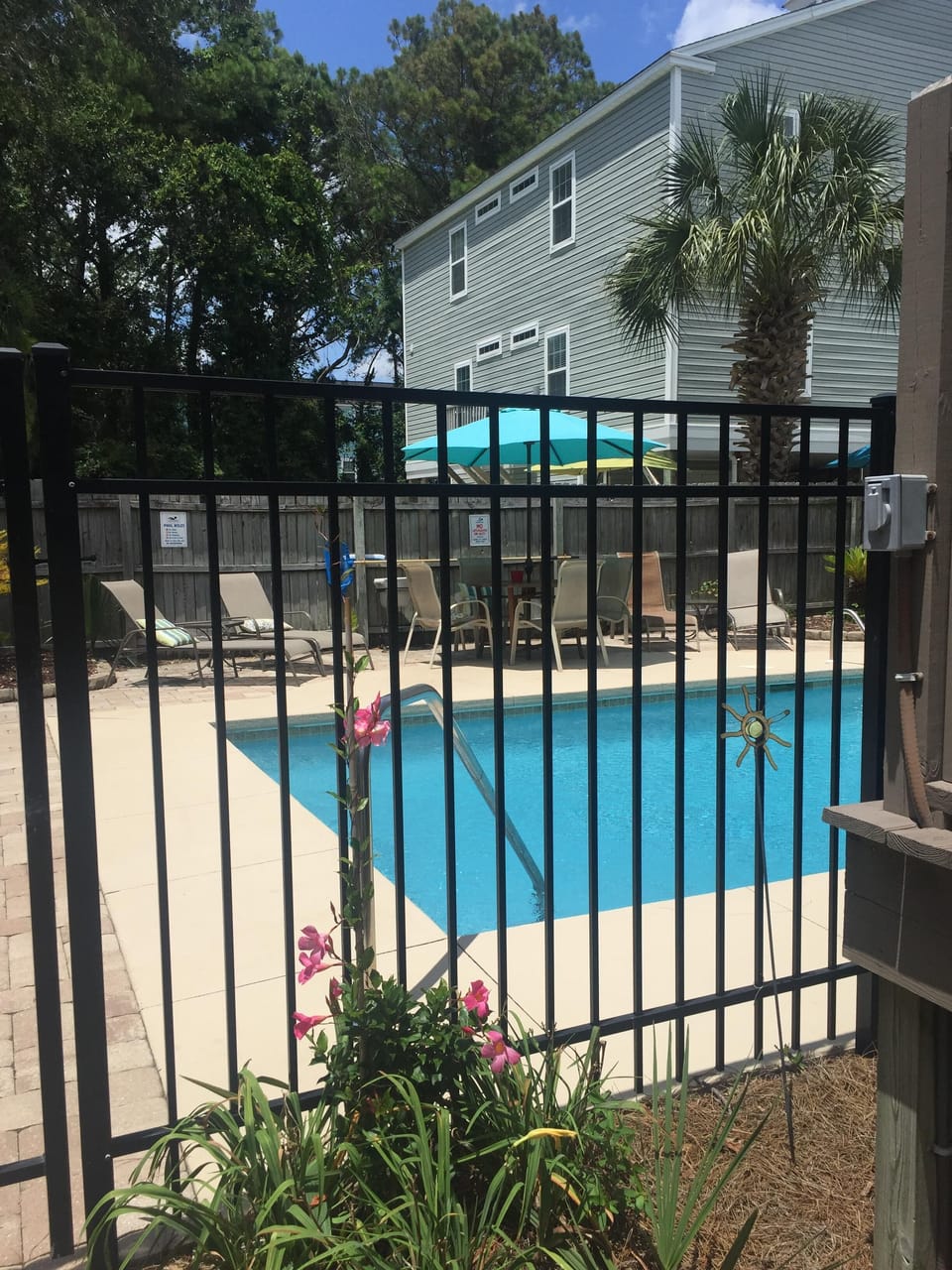 salt water pool-pool deck with seating and lounges