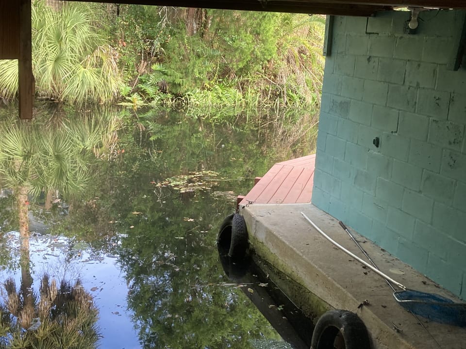 Water walkway from inside boathouse to side yard dock. 