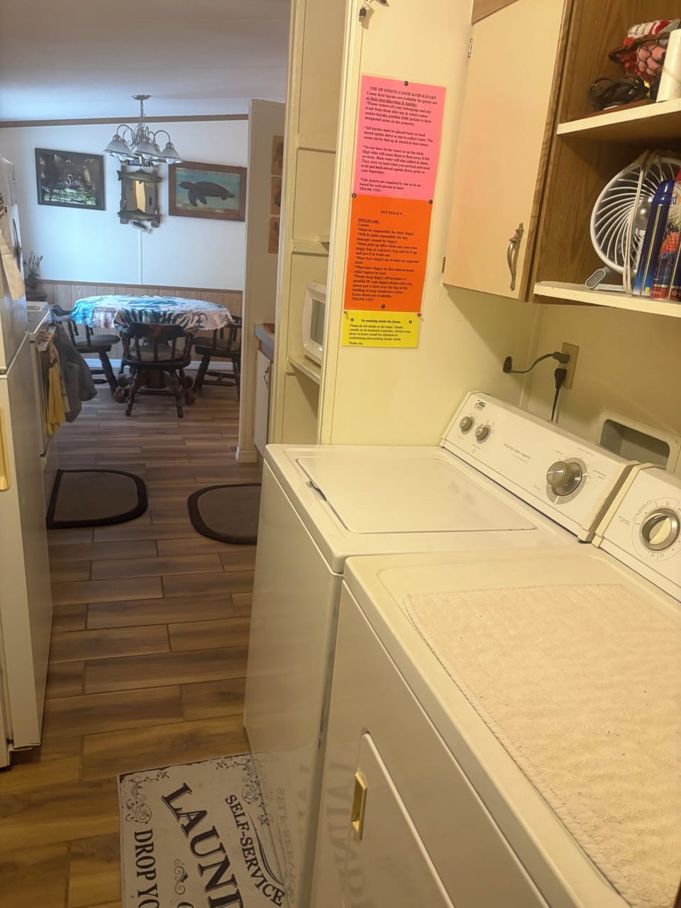 Washer and dryer at end of kitchen across from back door and main bathroom 