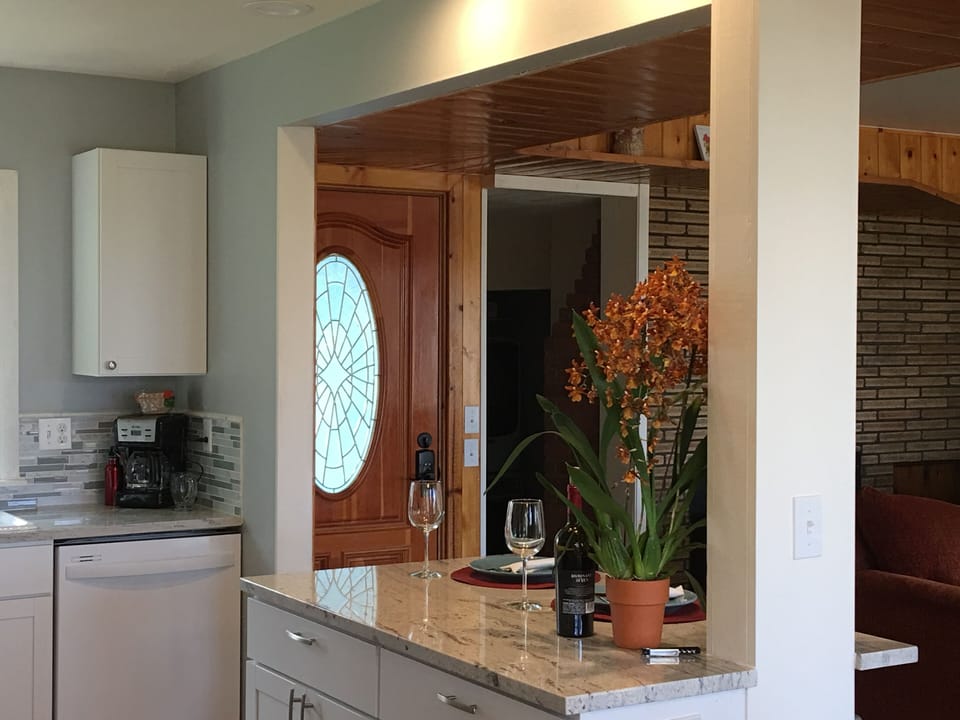 Looking at entry door from kitchen/dining area