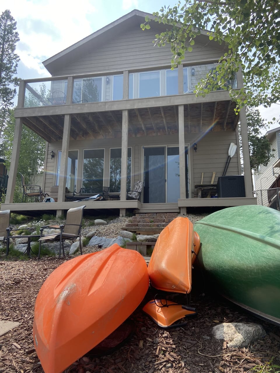 Newly painted in 2021, view lower and upper decks from lake side.