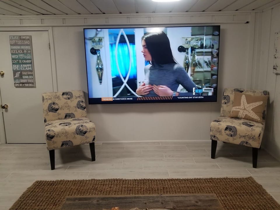Movie/ Game Room has a 85" TV and new bathroom. This area was just renovated. 