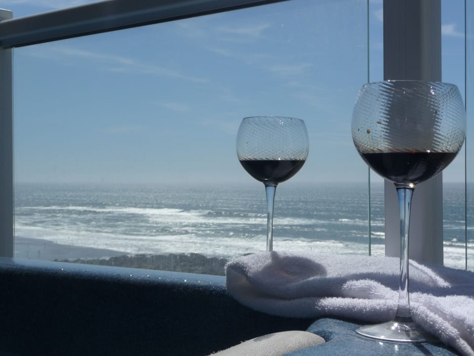 Enjoy The Sights And Sounds Of The Ocean From The Private Hot Tub