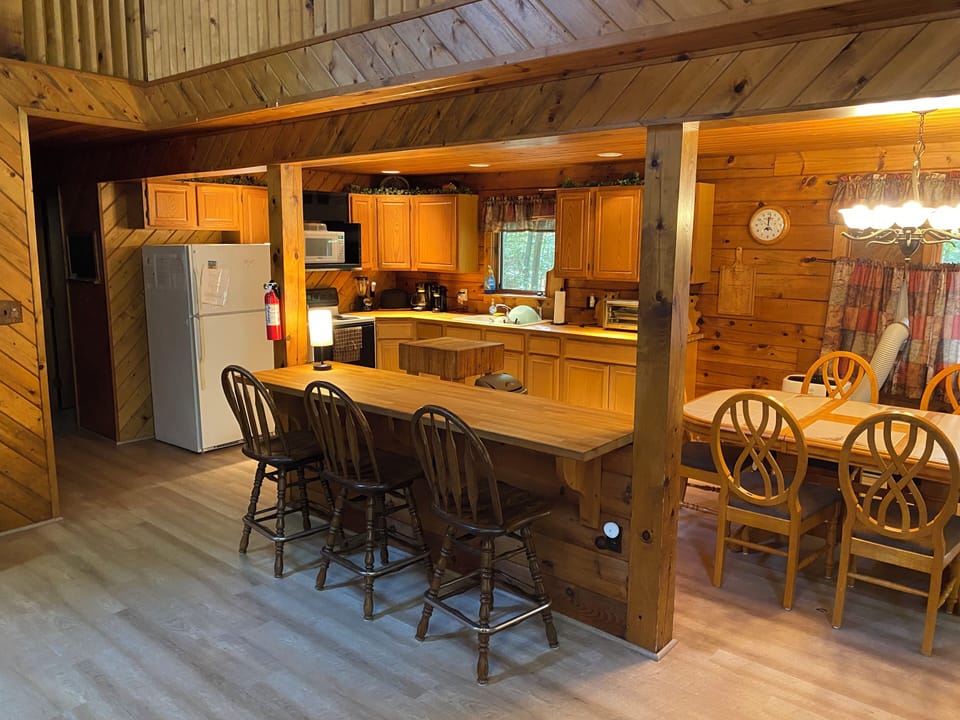 Kitchen, Bar, and Dining Area