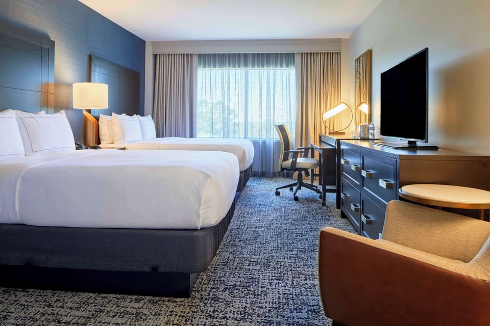 Premium bedding, down comforters, in-room safe, desk