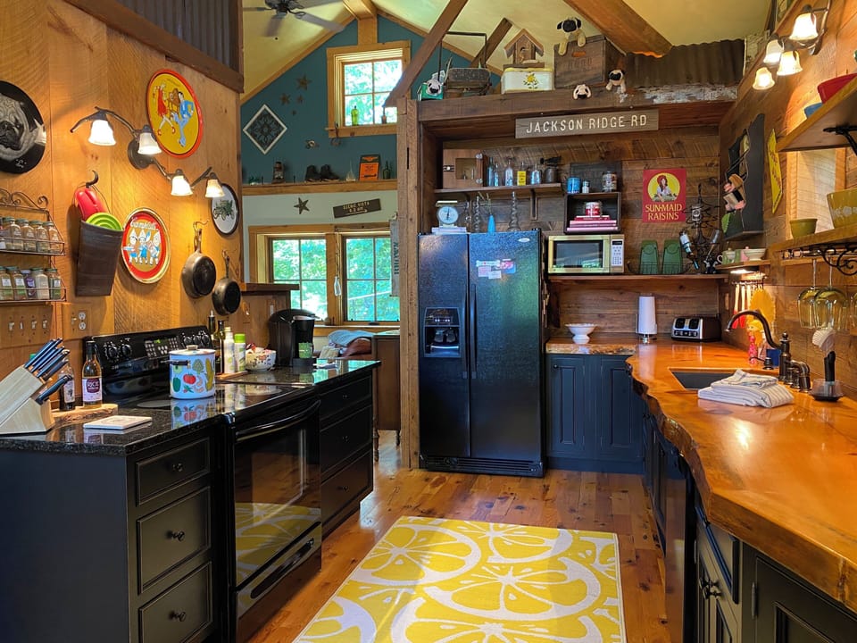 fully stocked kitchen, glass top stove, great views, open to living, dining