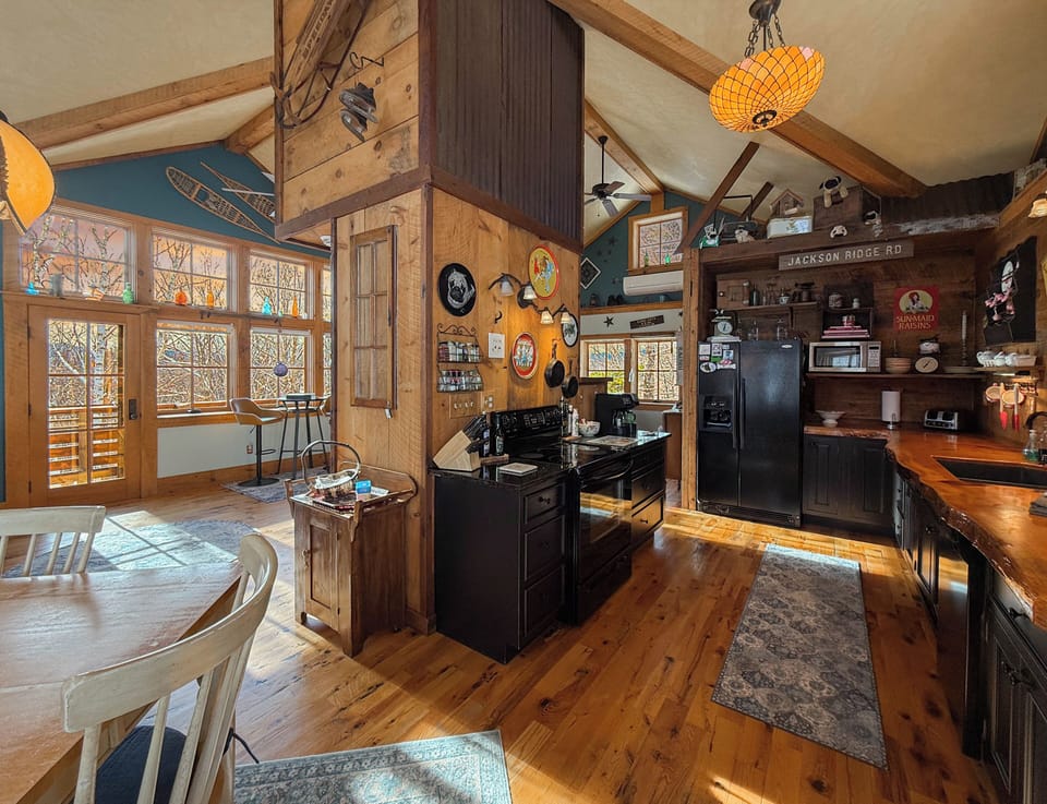 A kitchen designed for entertaining, fully stocked, open to living- dining areas