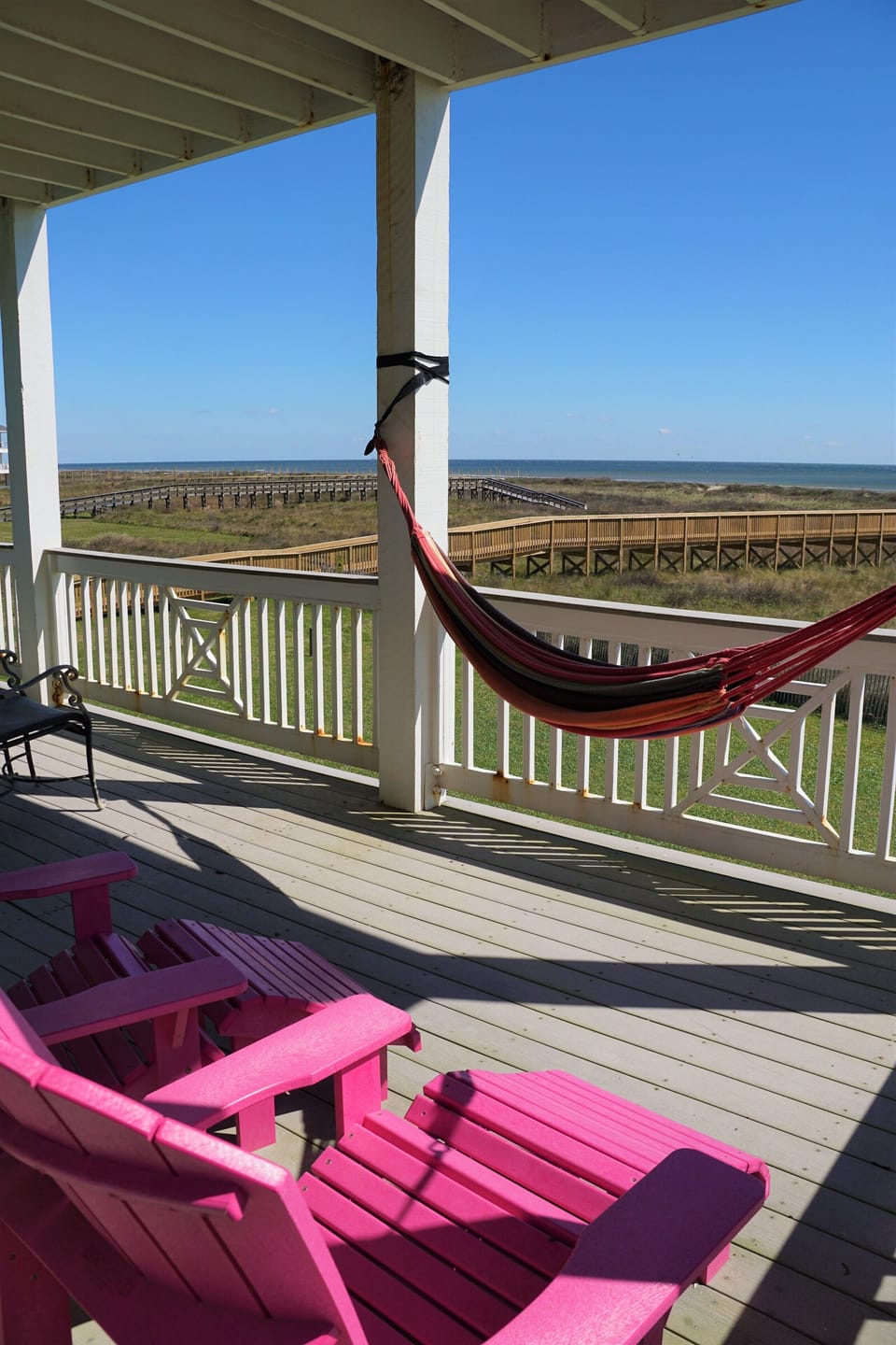 The balcony off of the master bedroom has a hammock and comfortable seating.