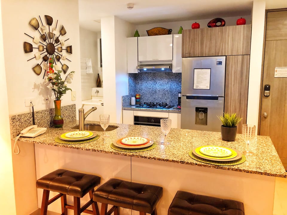 Granite countertops with updated modern faucet. Additional custom cabinetry.