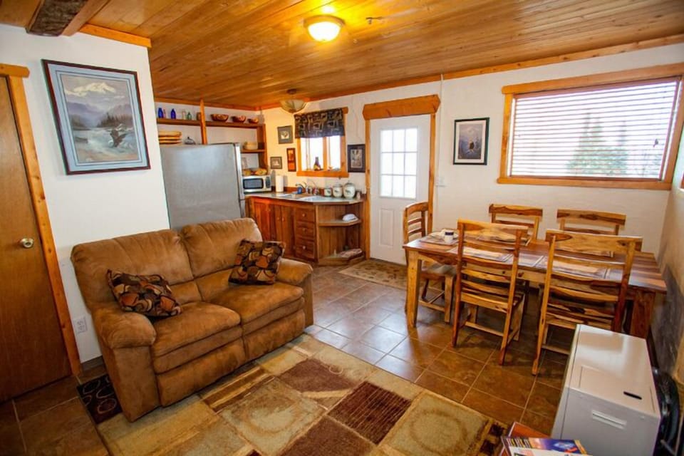 Lower level lounge, dining area and fully furnished kitchen.