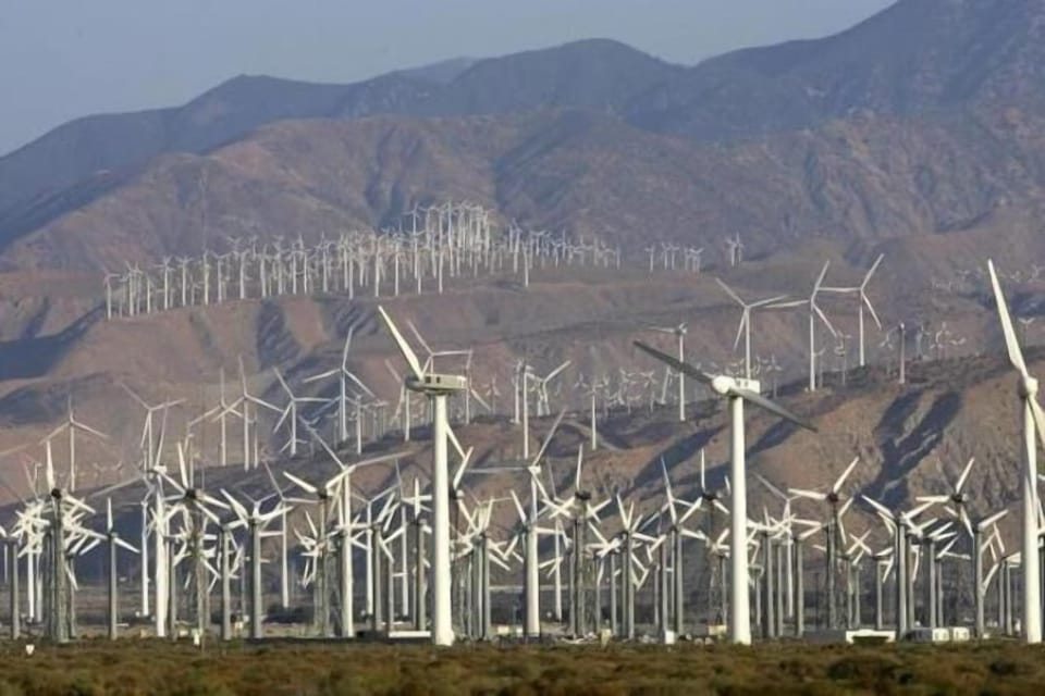Wind-power generators are seen near the 10 highway just south of PS.