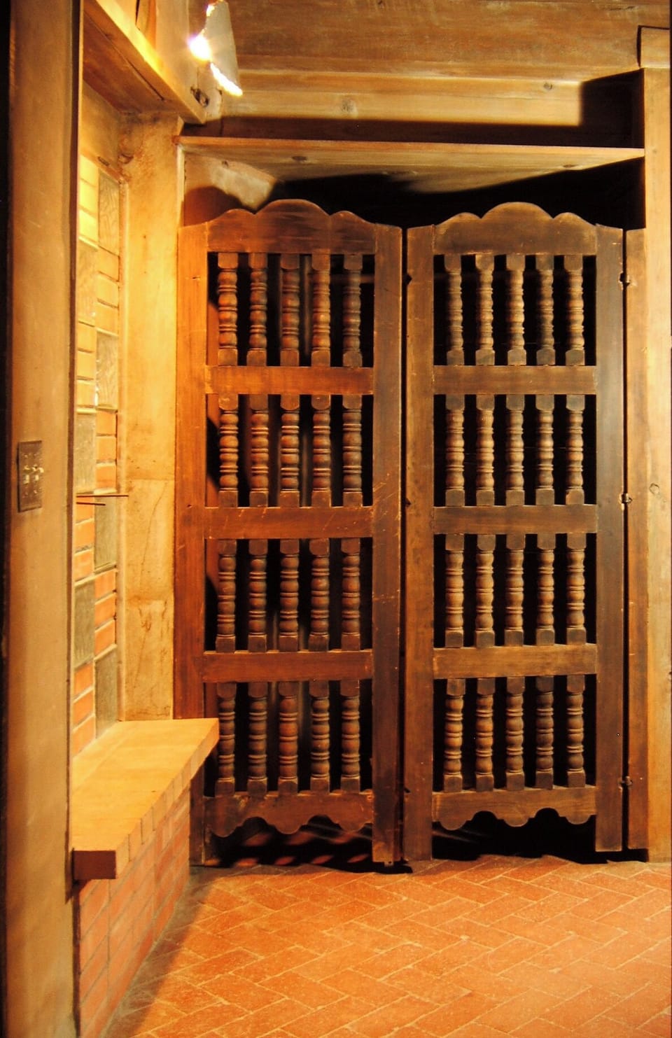 Architectural details--like these antique Spanish spindle  doors--grace the casa