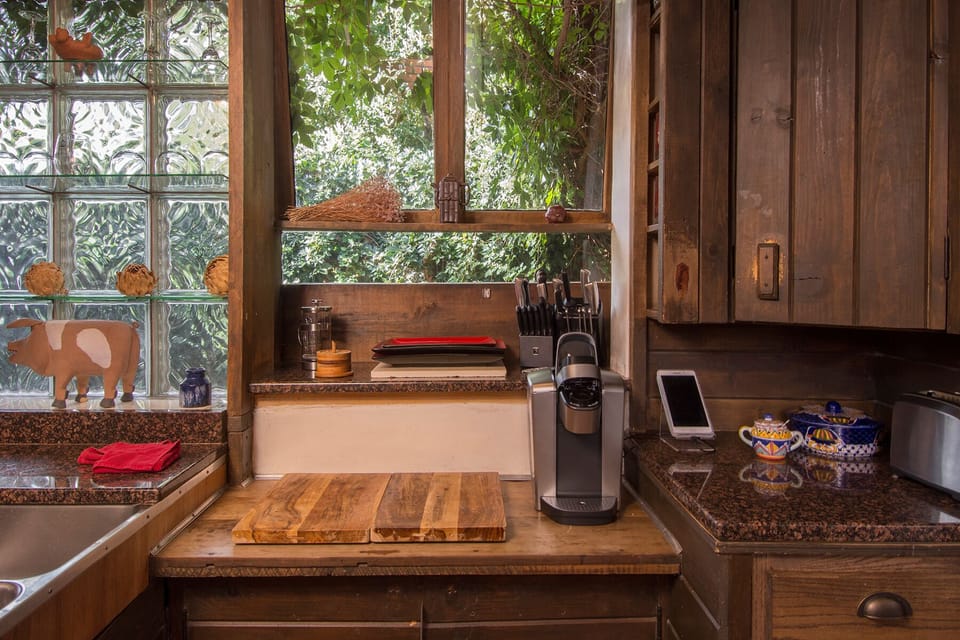 Food preparation area with Keurig, French Press, and Chinese tea pot.