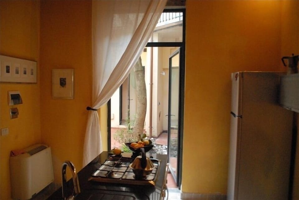 Kitchen, view 4, looking out to the courtyard/garden