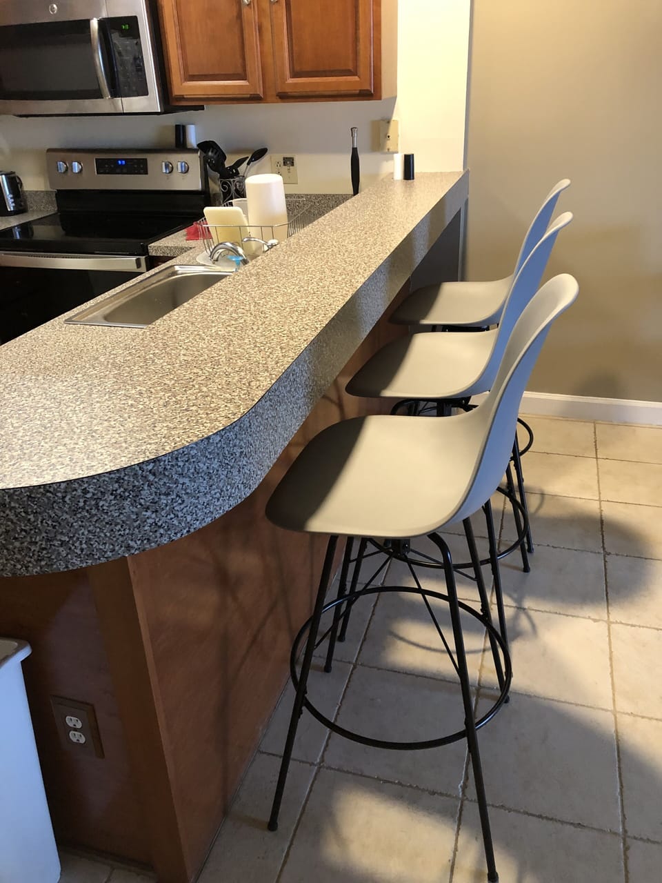 Hightop bar including new stools with backs.