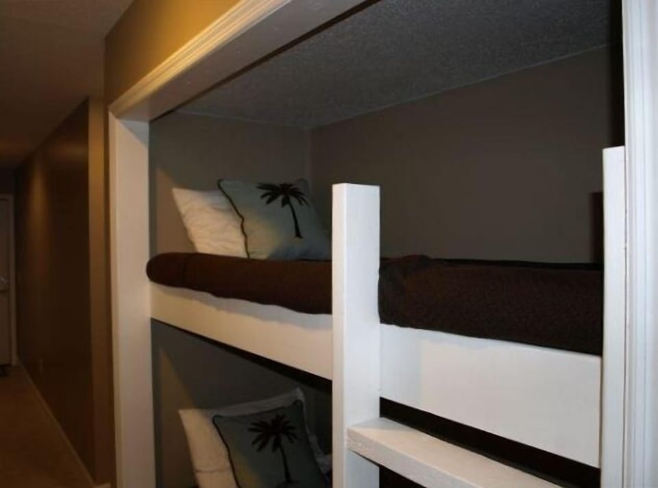 Built in bunk beds with attached ladder.  Kids love it!