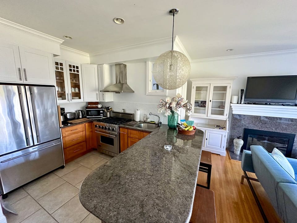 Open concept living space. granite bar seats 4