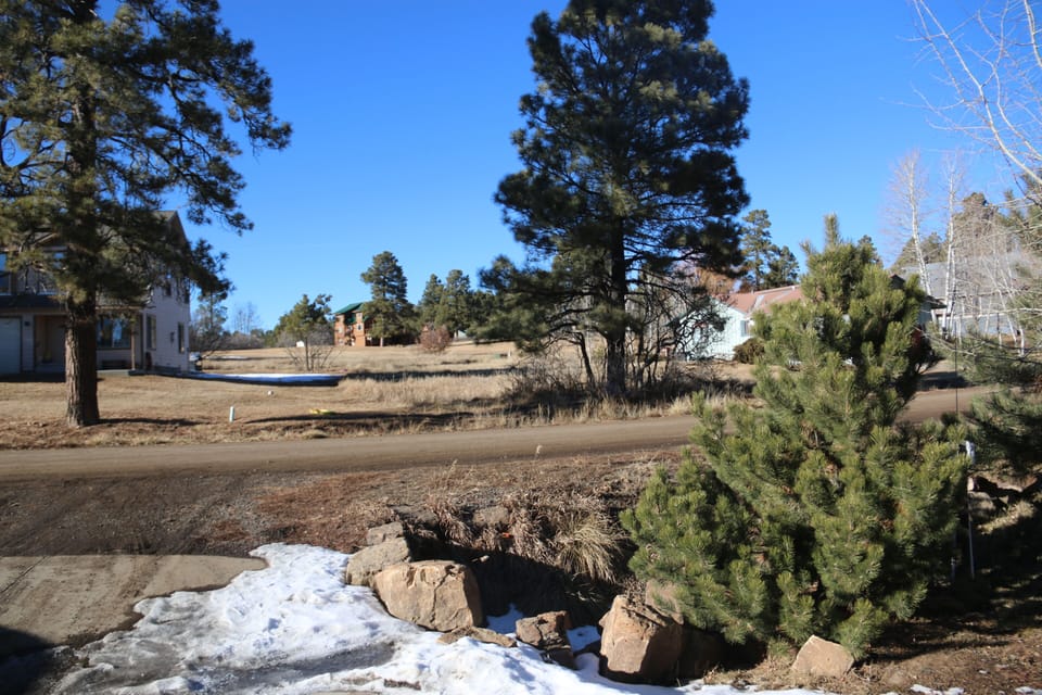 The view from the front porch. The large open area is part of the golf course
