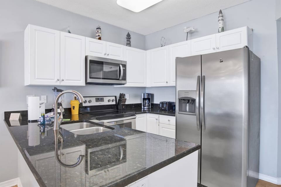 Kitchen with granite countertops and stainless steel appliances