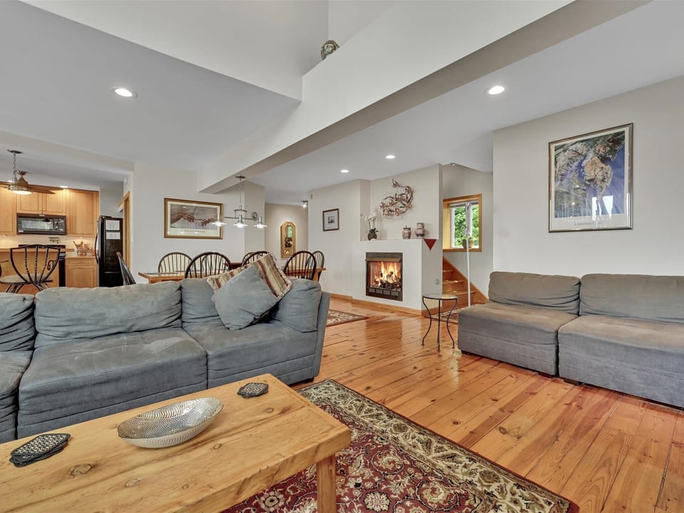Open floor plan, living room/ dinning room/ kitchen with fireplace.