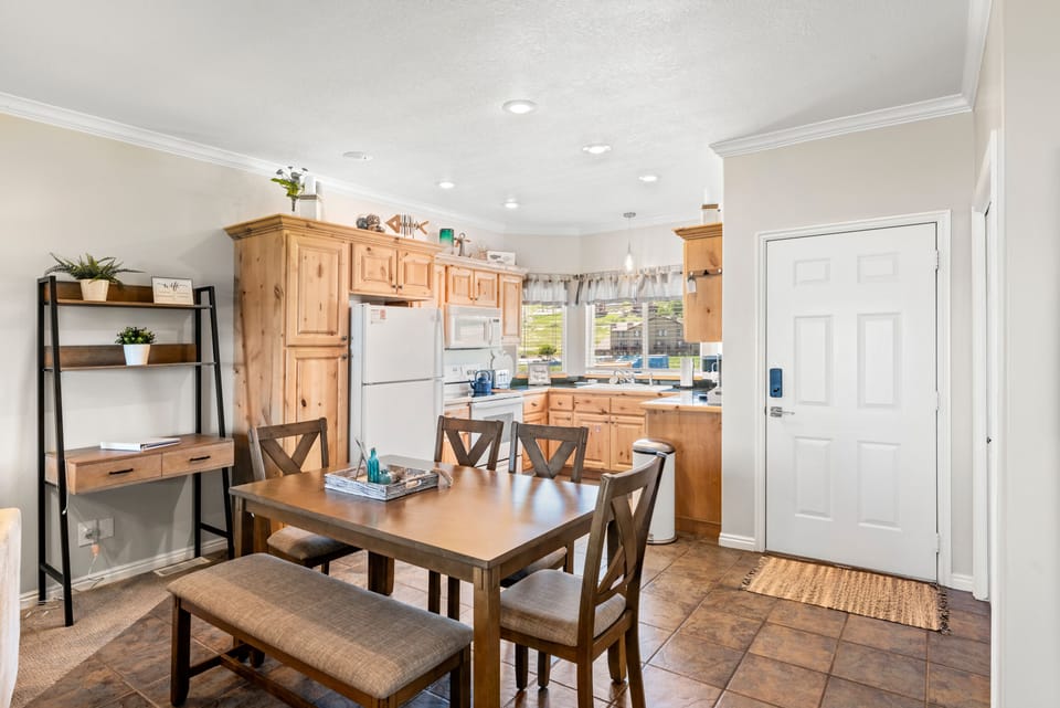 Dining area off the kitchen. Lots of room for everyone. A separate desk as well.