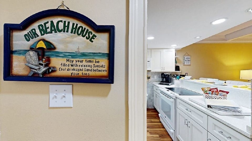 Our Beach house and view of the kitchen on the Left where you will find your key