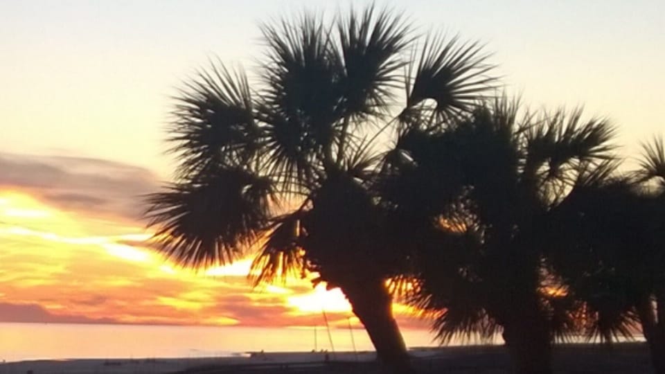 Your breath taking beautiful sunset over the ocean from the condo.  