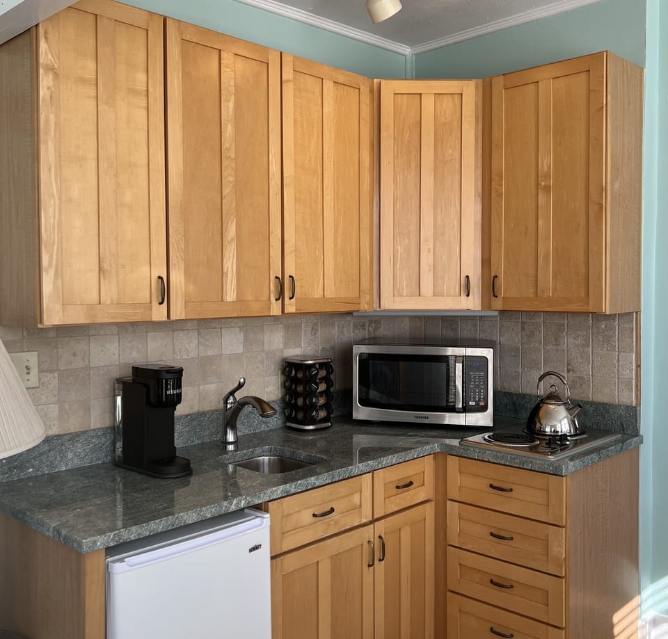 Efficiency kitchen- granite counter, mini fridge,  stove, convection microwave, 