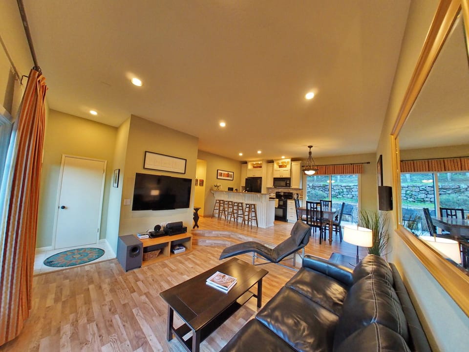 Open floor plan among entry, living room, kitchen and dining area