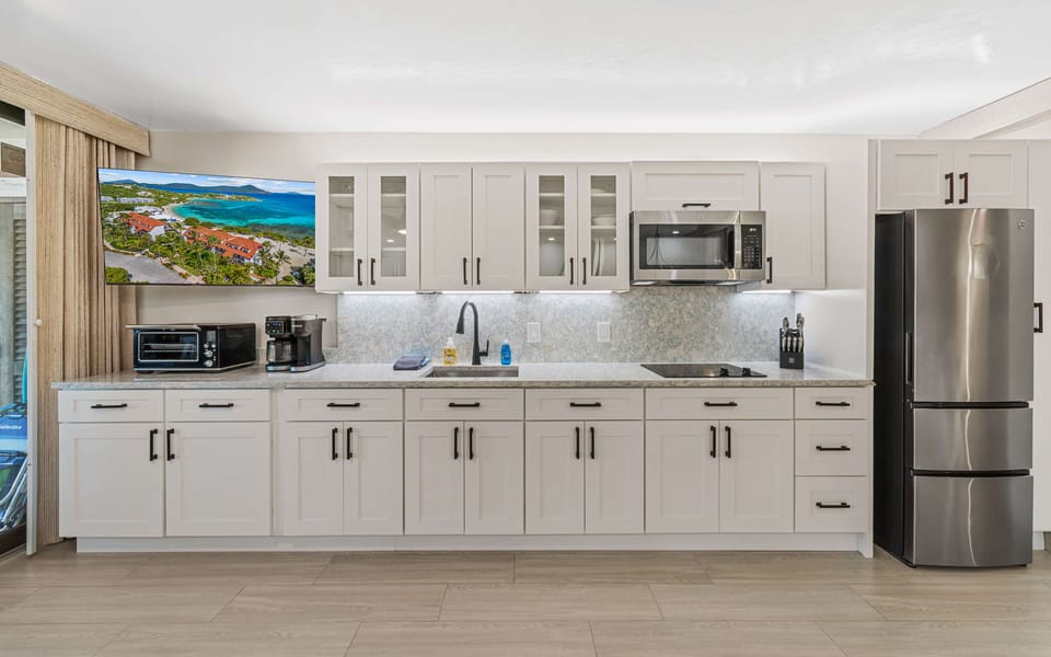 Kitchen includes stovetop, microwave, Breville toaster oven with air fryer