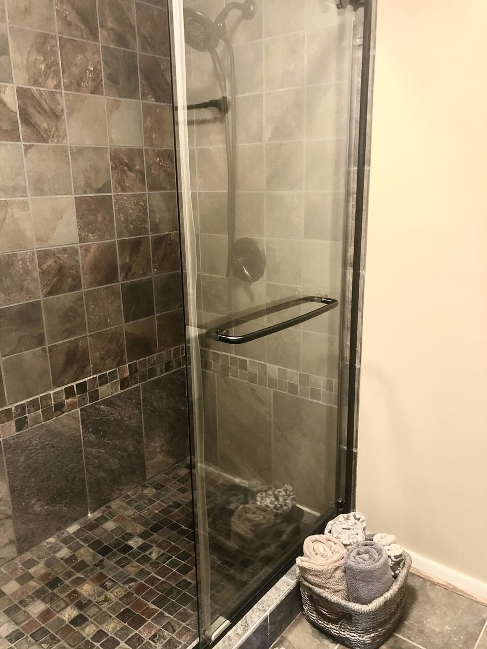 Generously sized tile shower in master bathroom