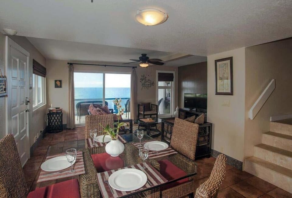 Dinette and living room view from  kitchen overlooking the bay.