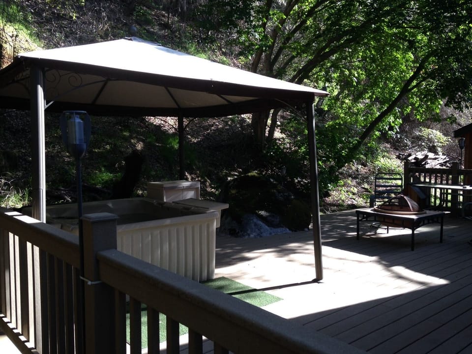Deck with hot tub and fire pit.