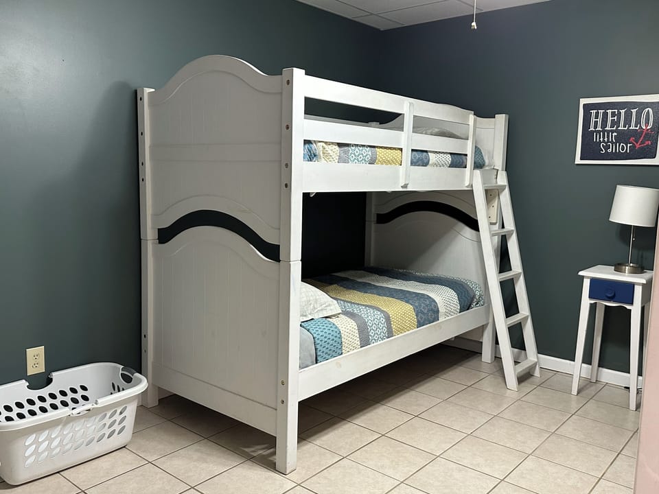 Bunk room with connecting bathroom on lower level