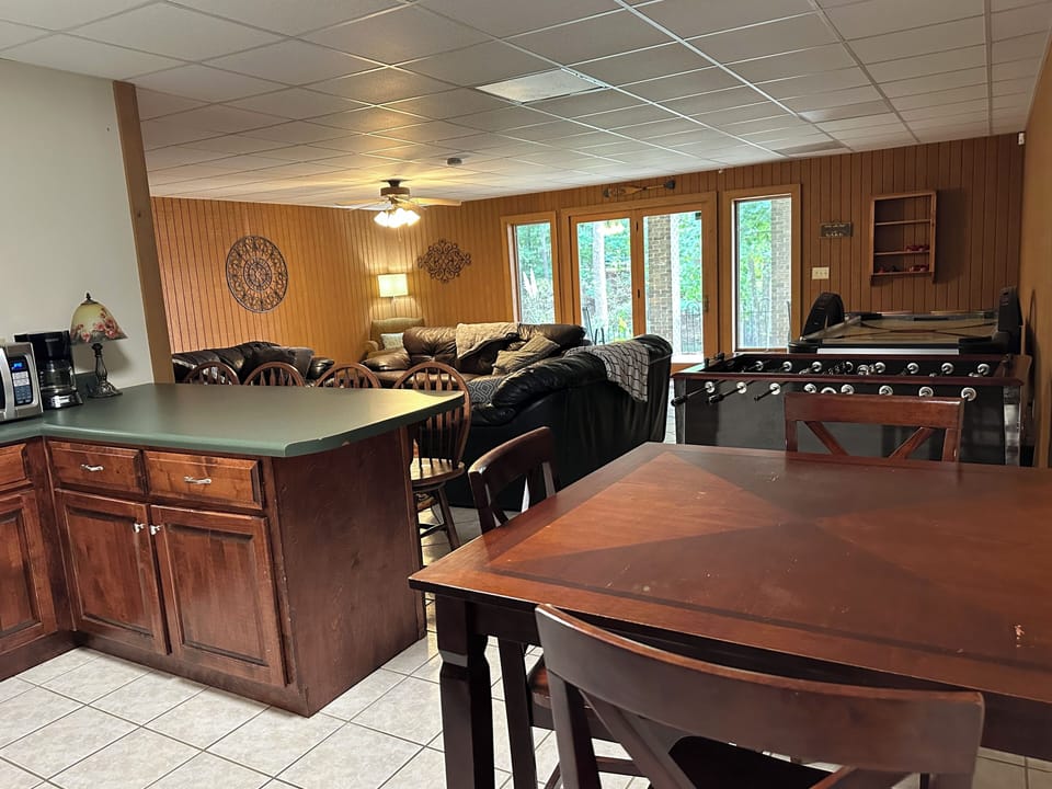 Living room lower level with walk out access to backyard and lake
