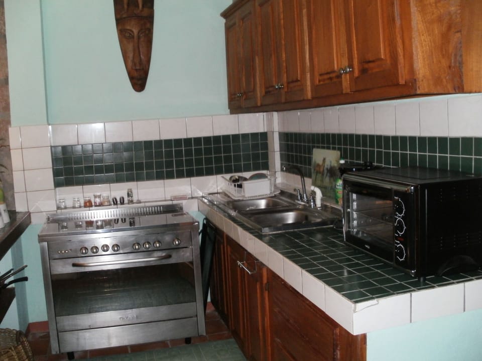 Kitchen with 5 burner stove, large toaster oven, 10 cup coffee maker