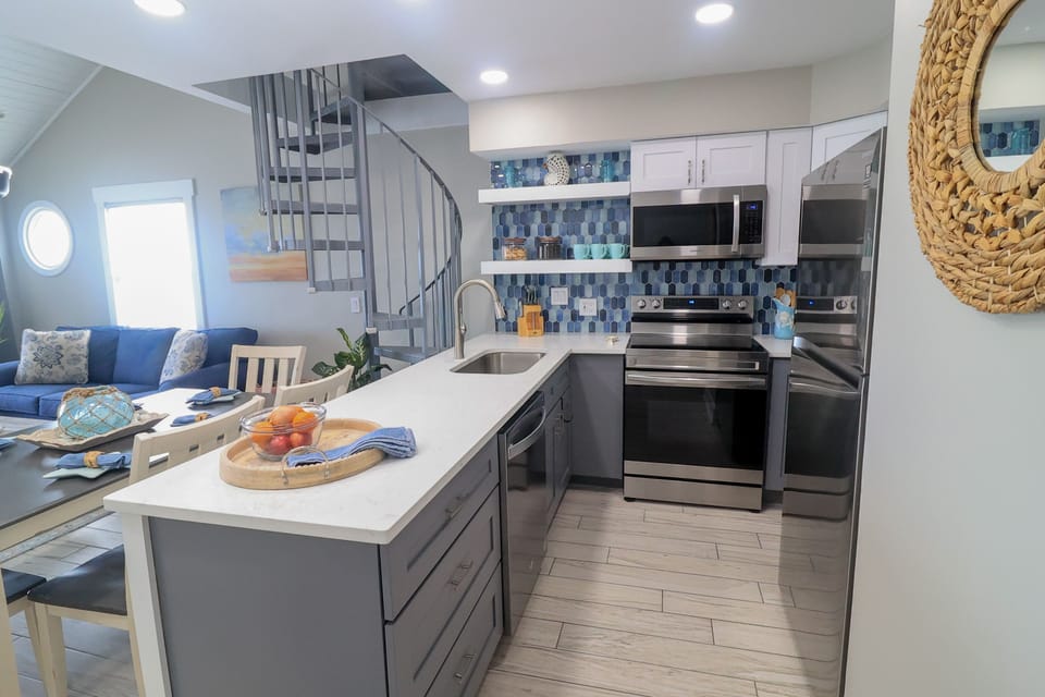 The kitchen has full size appliances and everything you need for eating in.