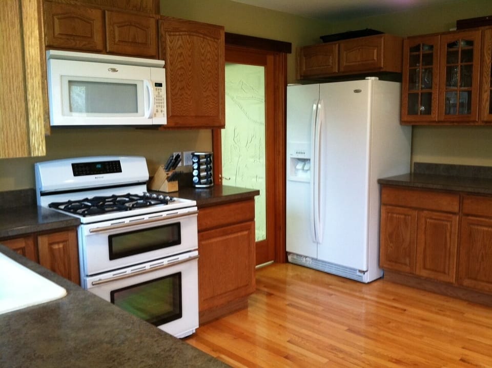 Double oven with gas range and full-size refrigerator