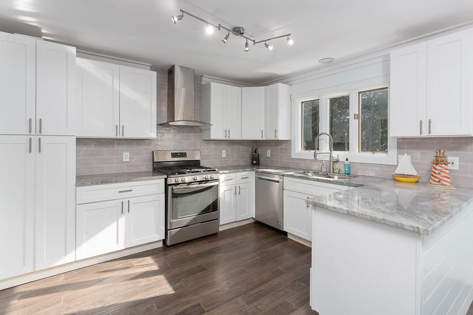 Large and bright kitchen, stainless appliances, gas range