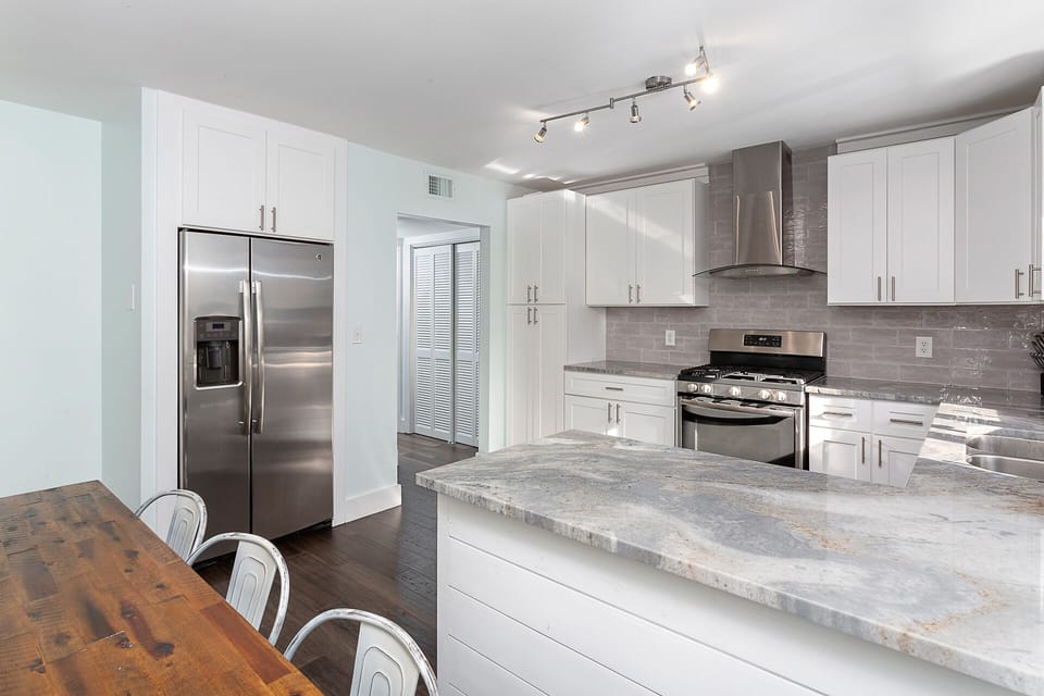 Large and bright kitchen, stainless appliances, gas range