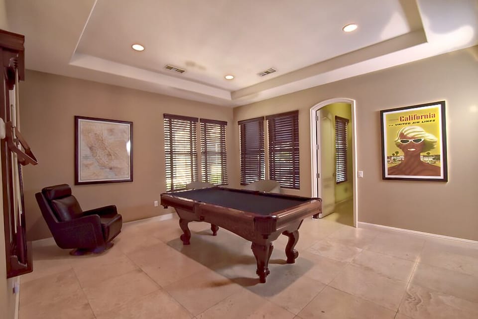 Welcome to the California Room with a custom Brunswick pool table and HDTV.