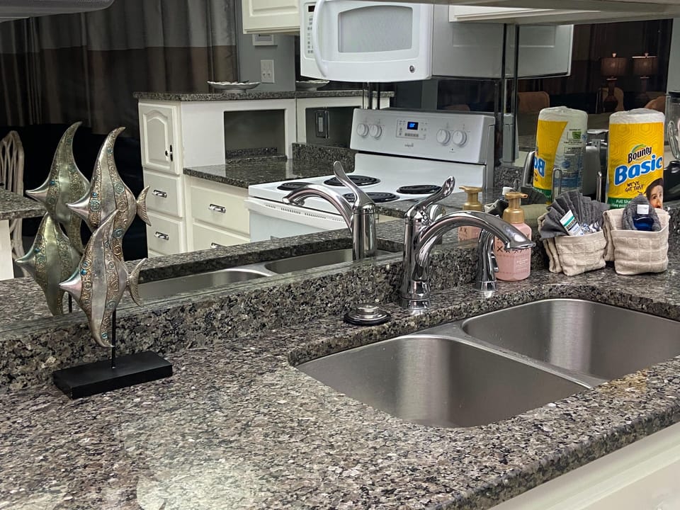 The kitchen features granite countertops and tons of cabinet space.