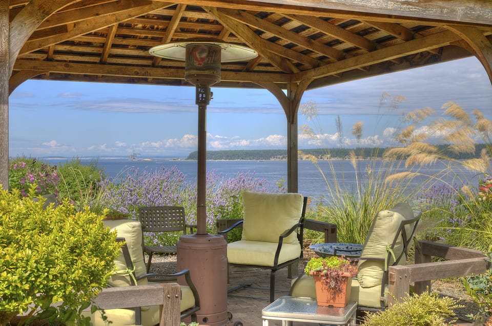 Relax in the gazebo with propane heater and four comfortable chairs.
