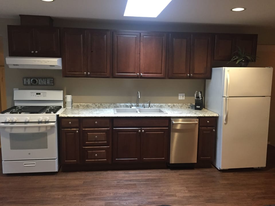 Recently remodeled kitchen with gas range/oven and Bosch dishwasher. 