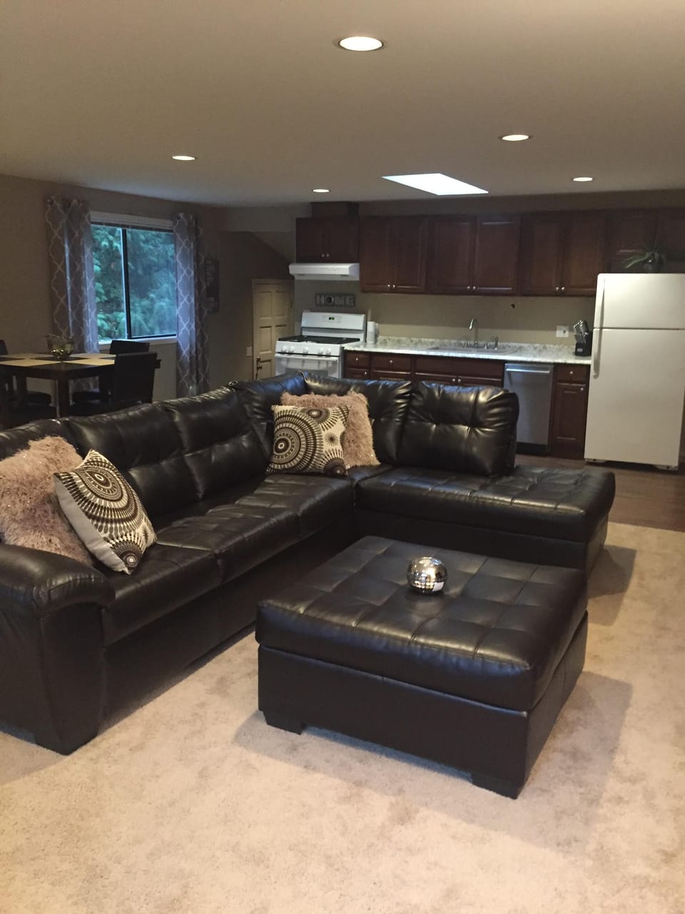 Large leather sectional provides great seating for friends and family