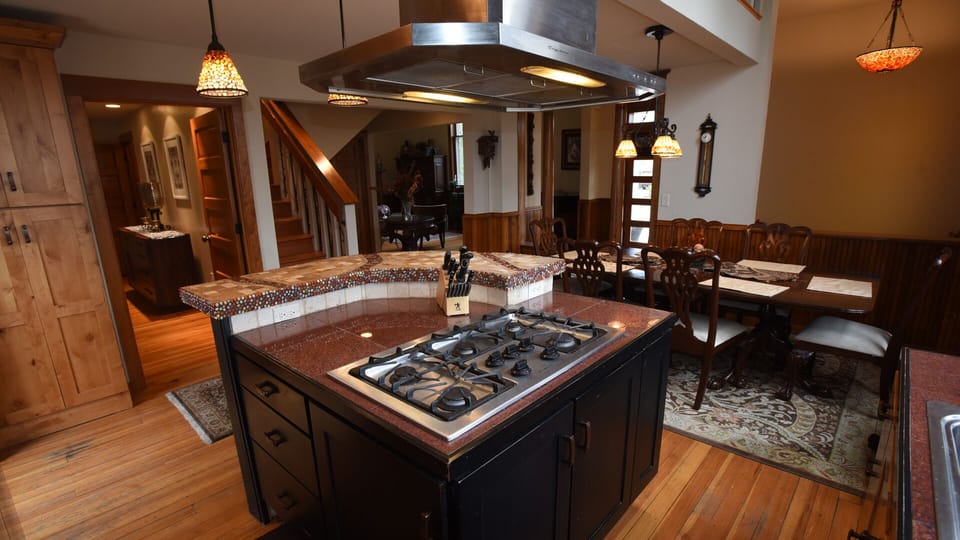 View from kitchen looking towards entry, living, half bath and master bedroom.